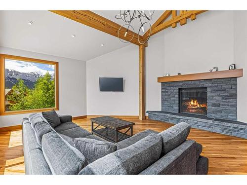 860 Silvertip Heights, Canmore, AB - Indoor Photo Showing Living Room With Fireplace