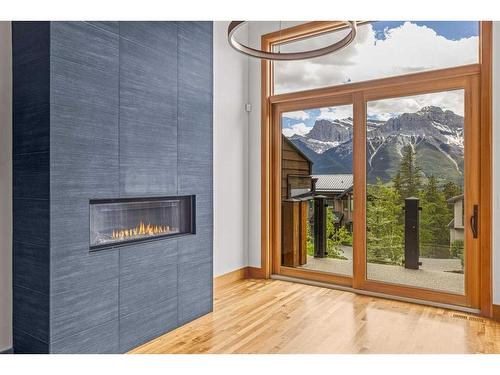 860 Silvertip Heights, Canmore, AB - Indoor Photo Showing Other Room With Fireplace