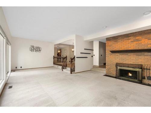 44-1901 Varsity Estates Drive Nw, Calgary, AB - Indoor Photo Showing Living Room With Fireplace