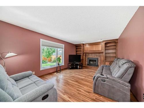 21 Sunhaven Link Se, Calgary, AB - Indoor Photo Showing Living Room With Fireplace