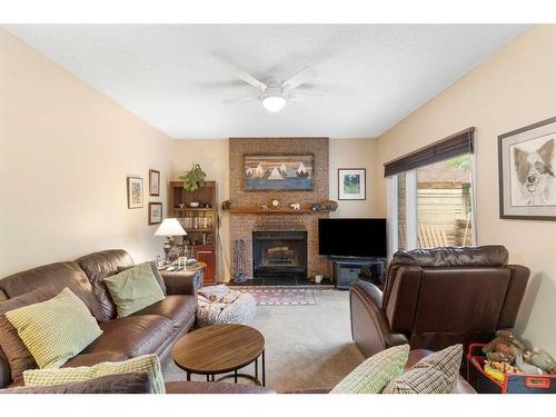 160 Berwick Way Nw, Calgary, AB - Indoor Photo Showing Living Room With Fireplace