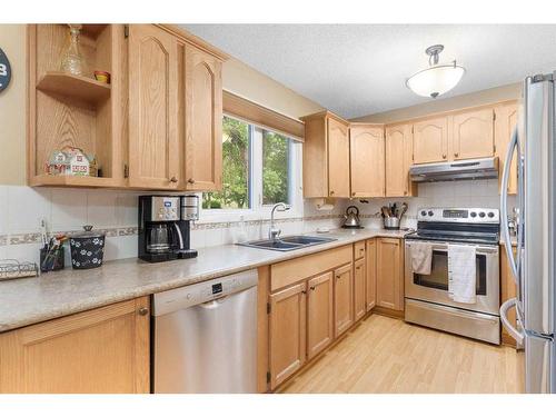 160 Berwick Way Nw, Calgary, AB - Indoor Photo Showing Kitchen With Stainless Steel Kitchen With Double Sink