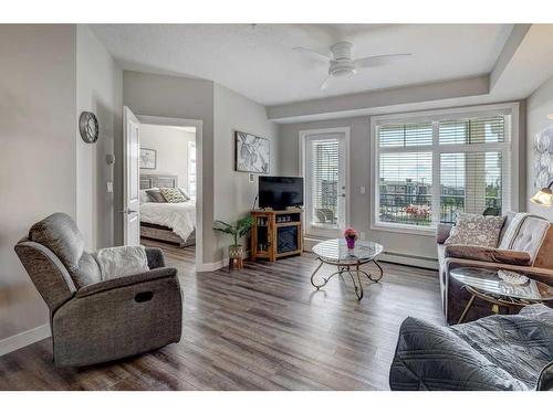 2210-3727 Sage Hill Drive Nw, Calgary, AB - Indoor Photo Showing Living Room