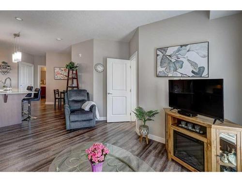 2210-3727 Sage Hill Drive Nw, Calgary, AB - Indoor Photo Showing Living Room