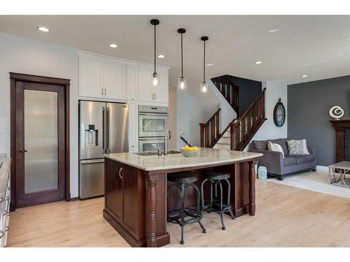 1177 Coopers Drive Sw, Airdrie, AB - Indoor Photo Showing Kitchen With Upgraded Kitchen