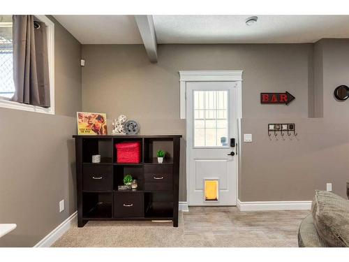 1177 Coopers Drive Sw, Airdrie, AB - Indoor With Fireplace