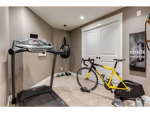 1177 Coopers Drive Sw, Airdrie, AB - Indoor Photo Showing Gym Room