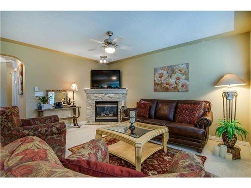 52 Cranleigh Drive Se, Calgary, AB - Indoor Photo Showing Living Room With Fireplace