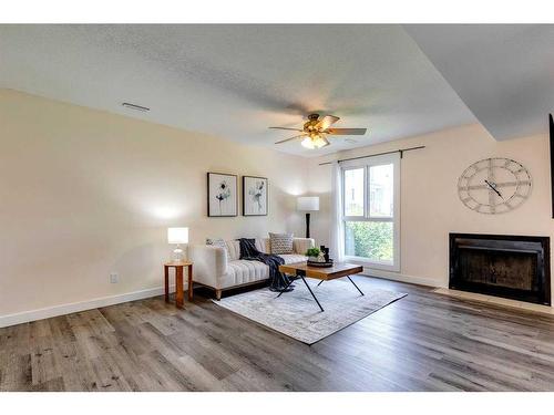 707-13104 Elbow Drive Sw, Calgary, AB - Indoor Photo Showing Living Room With Fireplace