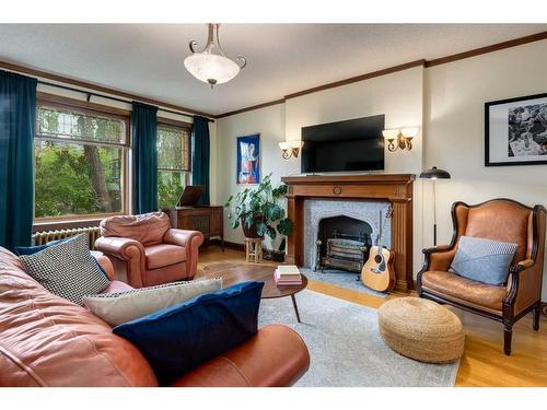 3-830 Memorial Drive Nw, Calgary, AB - Indoor Photo Showing Living Room With Fireplace