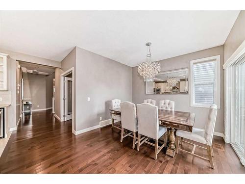 61 Evansview Manor Nw, Calgary, AB - Indoor Photo Showing Dining Room With Fireplace