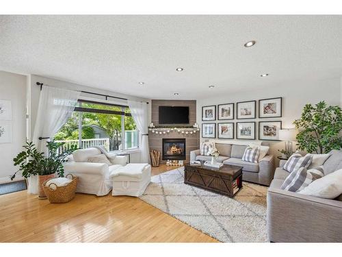 68 Crystalridge Crescent, Okotoks, AB - Indoor Photo Showing Living Room With Fireplace