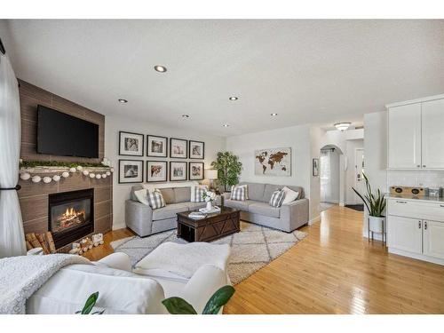 68 Crystalridge Crescent, Okotoks, AB - Indoor Photo Showing Living Room With Fireplace