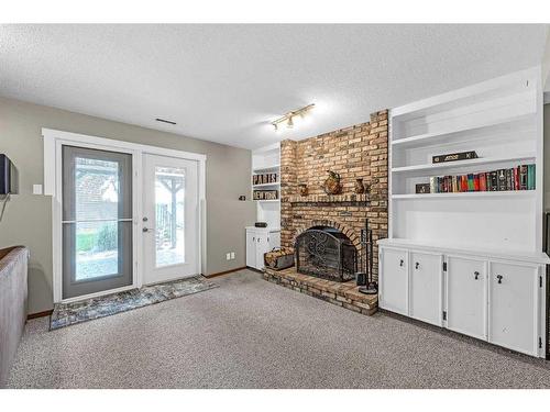 631 Ranch Estates Place Nw, Calgary, AB - Indoor With Fireplace