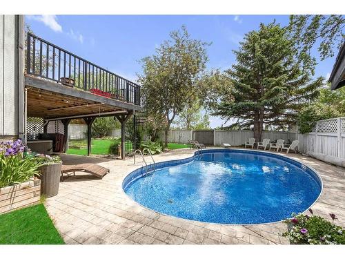 631 Ranch Estates Place Nw, Calgary, AB - Outdoor With In Ground Pool With Deck Patio Veranda With Backyard