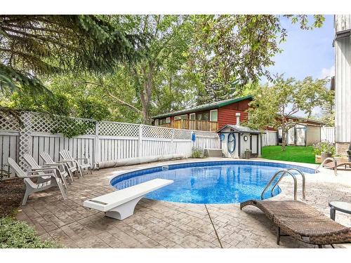 631 Ranch Estates Place Nw, Calgary, AB - Outdoor With In Ground Pool With Backyard