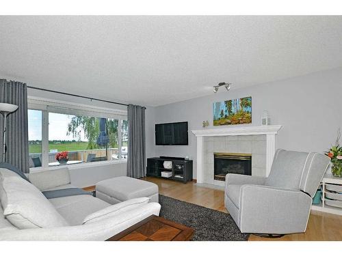 68 Chaparral Crescent Se, Calgary, AB - Indoor Photo Showing Living Room With Fireplace