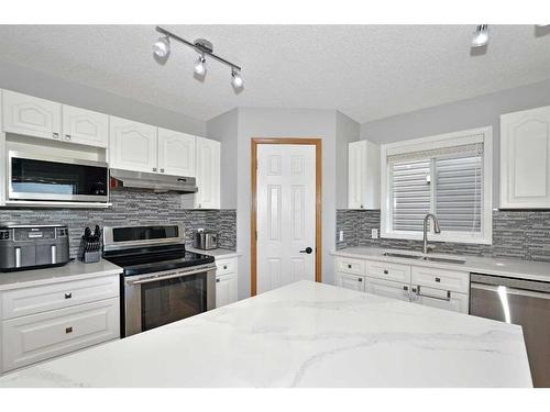 68 Chaparral Crescent Se, Calgary, AB - Indoor Photo Showing Kitchen With Stainless Steel Kitchen With Double Sink With Upgraded Kitchen