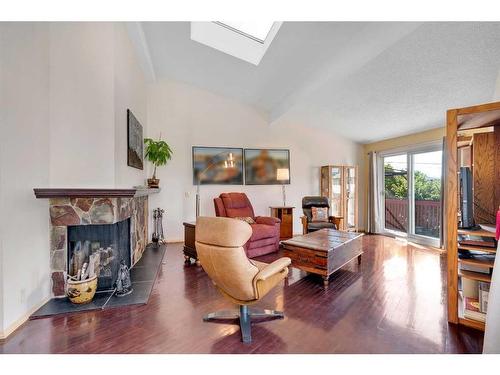 4902 22 Avenue Nw, Calgary, AB - Indoor Photo Showing Living Room With Fireplace