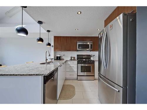 307-118 34 Street Nw, Calgary, AB - Indoor Photo Showing Kitchen With Stainless Steel Kitchen