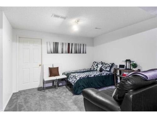 45 Patina Park Sw, Calgary, AB - Indoor Photo Showing Bedroom