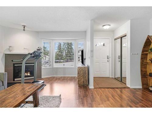 45 Patina Park Sw, Calgary, AB - Indoor With Fireplace