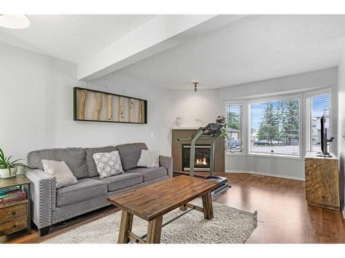 45 Patina Park Sw, Calgary, AB - Indoor Photo Showing Living Room With Fireplace
