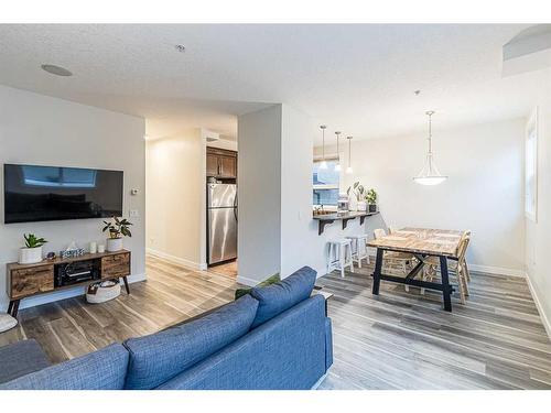 103-41 6 Street Ne, Calgary, AB - Indoor Photo Showing Living Room