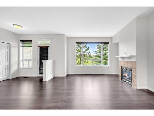 19 Kincora Heath Nw, Calgary, AB - Indoor Photo Showing Living Room With Fireplace