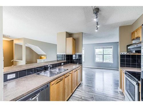 128 Country Village Cape Ne, Calgary, AB - Indoor Photo Showing Kitchen With Double Sink