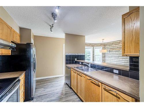 128 Country Village Cape Ne, Calgary, AB - Indoor Photo Showing Kitchen With Double Sink