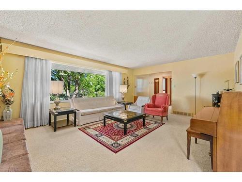 94 Cumberland Drive Nw, Calgary, AB - Indoor Photo Showing Living Room With Fireplace