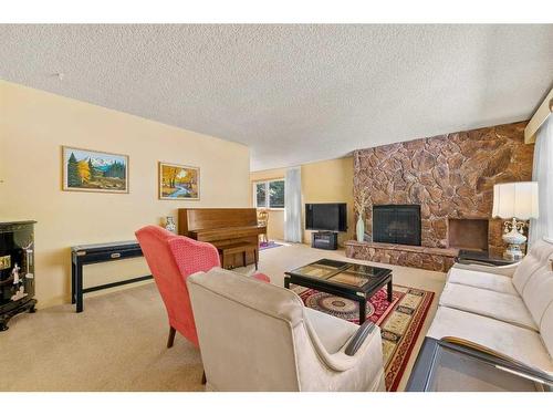 94 Cumberland Drive Nw, Calgary, AB - Indoor Photo Showing Living Room With Fireplace