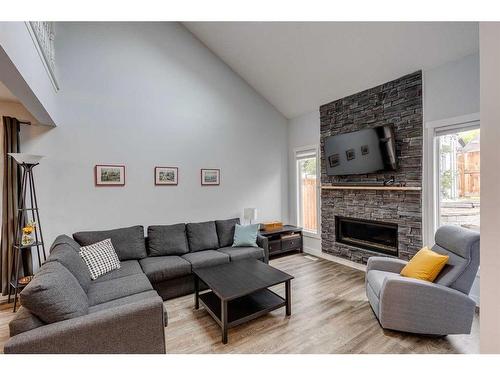7828 Ranchview Drive Nw, Calgary, AB - Indoor Photo Showing Living Room With Fireplace