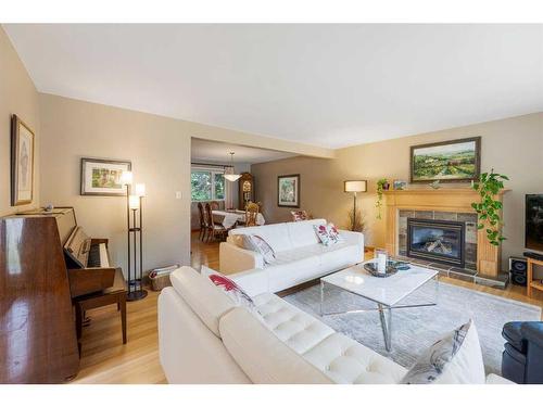 1015 80 Avenue Sw, Calgary, AB - Indoor Photo Showing Living Room With Fireplace