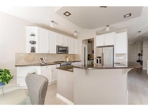 12481 Crestmont Boulevard Sw, Calgary, AB - Indoor Photo Showing Kitchen With Upgraded Kitchen