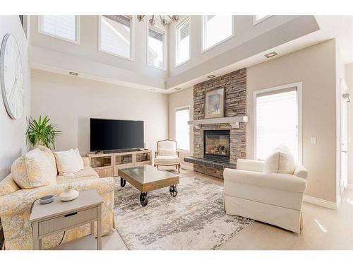 12481 Crestmont Boulevard Sw, Calgary, AB - Indoor Photo Showing Living Room With Fireplace