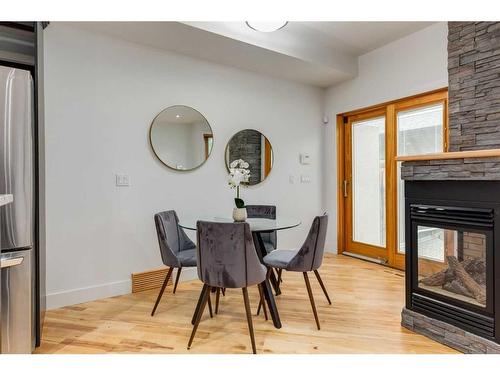 2325 22 Avenue Sw, Calgary, AB - Indoor Photo Showing Dining Room With Fireplace