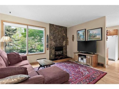 177 Macewan Glen Drive Nw, Calgary, AB - Indoor Photo Showing Living Room With Fireplace
