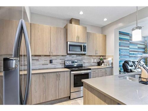18 Evanscrest Terrace Nw, Calgary, AB - Indoor Photo Showing Kitchen With Stainless Steel Kitchen With Double Sink