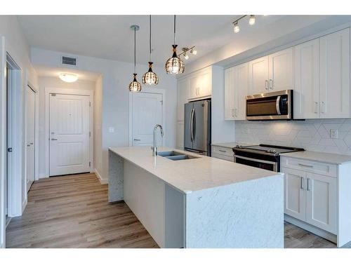 303-200 Auburn Meadows Common Se, Calgary, AB - Indoor Photo Showing Kitchen With Stainless Steel Kitchen With Double Sink With Upgraded Kitchen