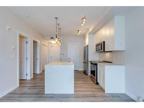 303-200 Auburn Meadows Common Se, Calgary, AB - Indoor Photo Showing Kitchen With Upgraded Kitchen