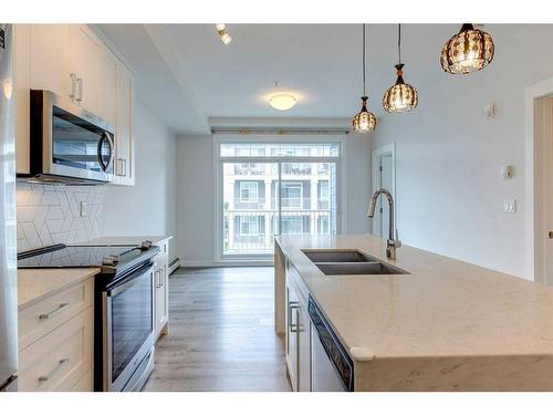 303-200 Auburn Meadows Common Se, Calgary, AB - Indoor Photo Showing Kitchen With Double Sink With Upgraded Kitchen