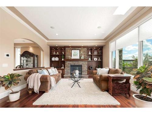 227 Aspen Ridge Place Sw, Calgary, AB - Indoor Photo Showing Living Room With Fireplace