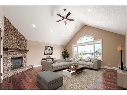 227 Aspen Ridge Place Sw, Calgary, AB - Indoor Photo Showing Living Room With Fireplace