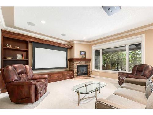 227 Aspen Ridge Place Sw, Calgary, AB - Indoor Photo Showing Living Room With Fireplace