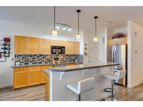 220 Chapala Drive Se, Calgary, AB - Indoor Photo Showing Kitchen With Upgraded Kitchen