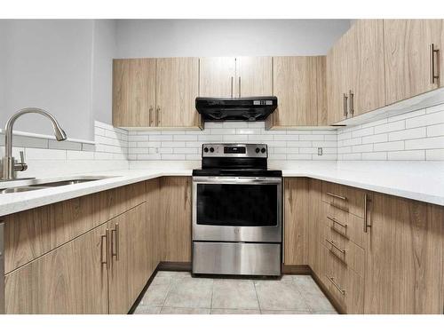 2112-1140 Taradale Drive Ne, Calgary, AB - Indoor Photo Showing Kitchen With Upgraded Kitchen