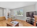 323-4525 31 Street Sw, Calgary, AB  - Indoor Photo Showing Living Room 