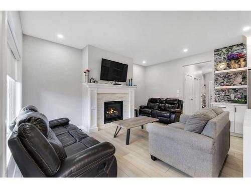 24 Saddlestone Way, Calgary, AB - Indoor Photo Showing Living Room With Fireplace